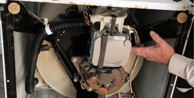 Water inside a commercial washing machine drum and door