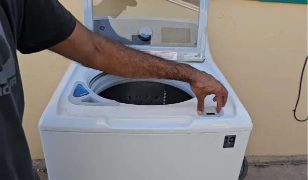 Commercial washing machines in a bright laundry facility
